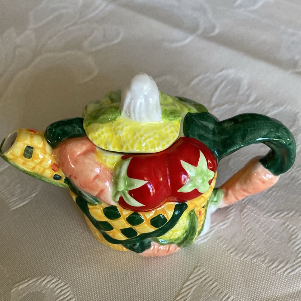 Tiny 3 1/2” vegetables in basket porcel, 2 pc. teapot w/ fitted lid.   $20